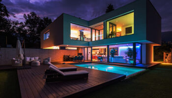 Modern villa with colored led lights at night. Nobody inside